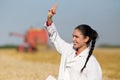 Woman agronomist in wheat field