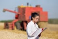 Woman agronomist in wheat field