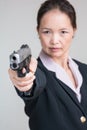 Woman aiming a hand gun