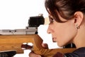 Woman aiming a pneumatic air rifle Royalty Free Stock Photo