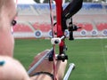 Woman aiming to a target in a archery competition