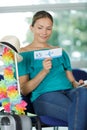 Woman in airport reading ticket