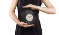 Woman with alarm clock between hands, isolated on white, magic