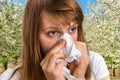 Woman with allergy near flowering trees Royalty Free Stock Photo