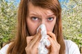 Woman with allergy near flowering trees