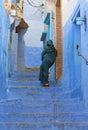 A woman in the Alley In The Blue City