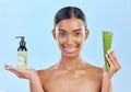 Woman, aloe vera and skincare in studio portrait with smile, natural choice and happy by blue background. Girl, model Royalty Free Stock Photo