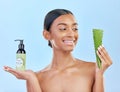 Woman, aloe vera and skincare in studio with smile, natural choice and happy by blue background. Girl, model and cactus Royalty Free Stock Photo