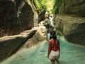 Woman alone on the green canyon in Dao Falls in Cebu Island, Philippines Royalty Free Stock Photo