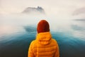 Woman alone looking at foggy cold sea traveling adventure lifestyle Royalty Free Stock Photo