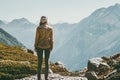 Woman alone standing in mountains wander landscape