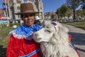 Woman with alpaaca at central square of Huaraz