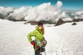 Woman alpinist climbing in mountains