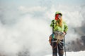 Woman alpinist drinking tea on mountain