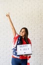 woman with american flag holding lightbox with words Happy 4 July