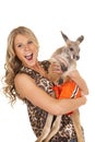 Woman in animal print shirt hold kangaroo happy