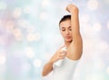 Woman with antiperspirant deodorant over white Royalty Free Stock Photo