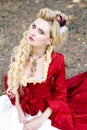 Woman in antique red dress Royalty Free Stock Photo