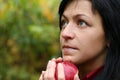 Woman and apple in autumn park Royalty Free Stock Photo