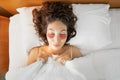 Woman applied eye patches and got ready to sleep in her bed, so that in the morning there were no bruises and swelling