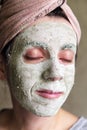 The woman applied green clay to her face as part of her regular cosmetic procedures