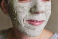 The woman applied green clay to her face as part of her regular cosmetic procedures