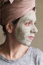 The woman applied green clay to her face as part of her regular cosmetic procedures