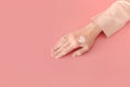 Woman applied heart shaped smear of cream lotion on hand. Self-love body positive concept. Feminine blog and social media