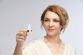 Woman apply eye drops. Girl glaucoma treatment Royalty Free Stock Photo