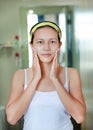 Woman applying aloe vera cream to face Royalty Free Stock Photo