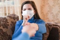 Woman applying antiseptic gel at home, closeup. Infection preventenion concept. Pandemic Coronavirus