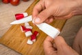 Woman is applying band aid plaster on her finger Royalty Free Stock Photo