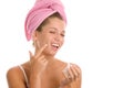 Woman applying cream on face Royalty Free Stock Photo
