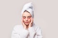 Woman applying eye patches. Close up portrait girl with towel on head. Facial collagen skincare cosmetic. Moisturizing Royalty Free Stock Photo