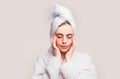Woman applying eye patches. Close up portrait girl with towel on head. Facial collagen skincare cosmetic. Moisturizing Royalty Free Stock Photo