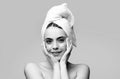 Woman applying eye patches. Portrait beauty girl with towel on head. Royalty Free Stock Photo