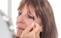Woman applying eyeshadow powder Royalty Free Stock Photo