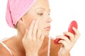 Woman applying facial cream Royalty Free Stock Photo