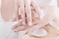 Woman applying hand lotion in the spa Royalty Free Stock Photo