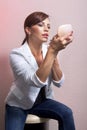 Woman applying her make-up l