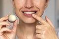 woman applying on lips balm or scrub from natural ingredients Royalty Free Stock Photo