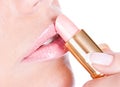 Woman applying lipstick Royalty Free Stock Photo