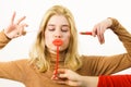 Woman applying lipstick or lip gloss