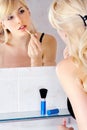 Woman Applying Makeup Royalty Free Stock Photo