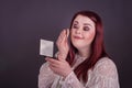 Woman applying makeup looking into compact mirror Royalty Free Stock Photo