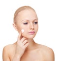 Woman applying moisturize cream. Royalty Free Stock Photo