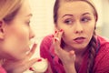 Woman applying moisturizing skin cream. Skincare. Royalty Free Stock Photo
