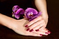 Woman applying nail varnish to finger nails Royalty Free Stock Photo