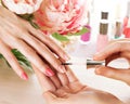 Woman applying nail varnish to finger nails Royalty Free Stock Photo