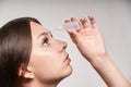 Woman applying ophthalmology eyedropper. Glaucoma eye prevention. human vision serum wash. using disease contact eyedrop